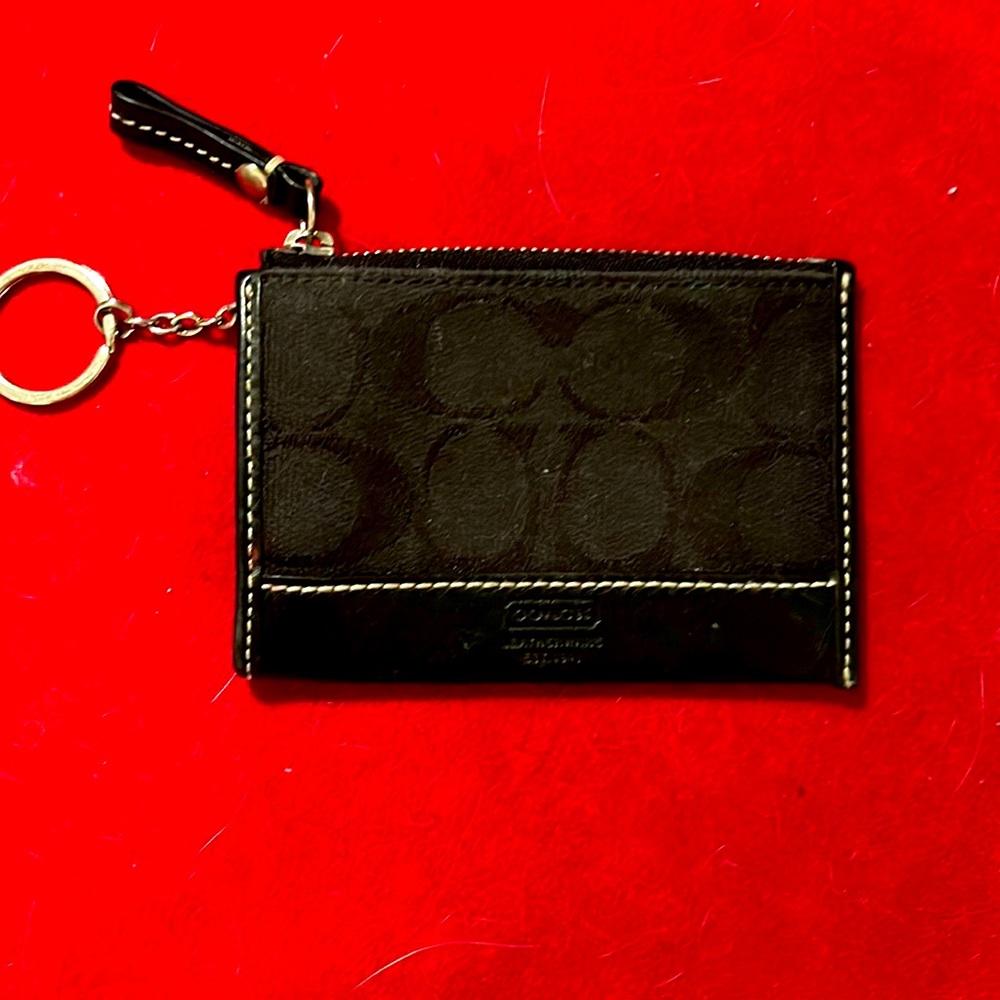 Coach key chain/card holder. Zip pouch for secret stash. Lol. Black on black.